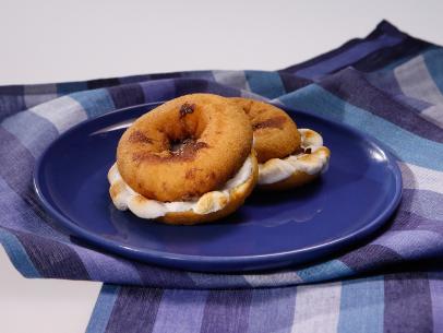 The S'mauro donut sandwich is displayed during an episode about the best snacks ever, as seen on Food Network's The Kitchen Sink, Season 1.