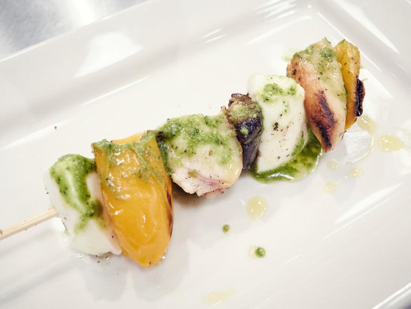 Contestant Dom Tesoriero's dish, Grilled Chicken and Mozzarella and Basil Pesto Skewers, for the Star Challenge: Cook Live, as seen on Food Network Star, Comeback Kitchen.
