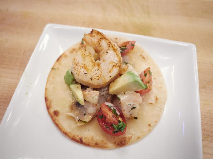 Finalist Damiano Carrara's dish, Shrimp and Clam Taco with Clam Wine Sauce, Avocado, Cherry Tomato and Parsley, for the Mash Up Star Challenge theme, Clam Chowder and Tacos, as seen on Food Network Star, Season 12.