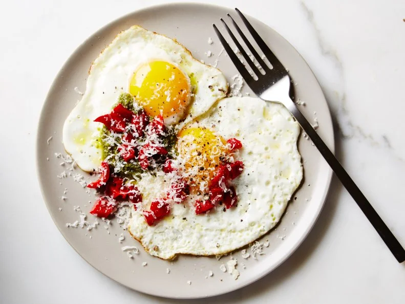 Food Network Kitchen's Pesto and Parmesan Eggs, as seen on Food Network.