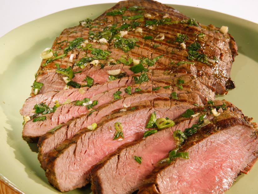 Garlic and herb steak is displayed during an episode about eleven ways to win at summer, as seen on Food Network's The Kitchen Sink, Season 1.