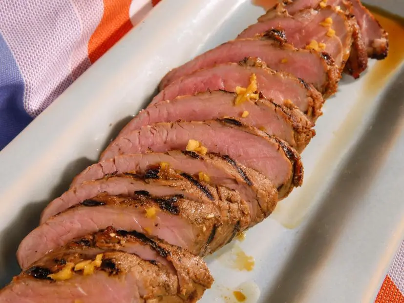 Tropical teriyaki pork is displayed during an episode about eleven ways to win at summer, as seen on Food Network's The Kitchen Sink, Season 1.