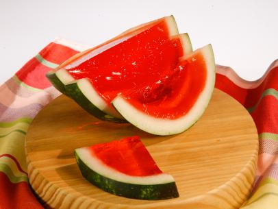 Watermelon gelatin shots are displayed during an episode about eleven ways to win at summer, as seen on Food Network's The Kitchen Sink, Season 1.