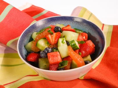 A refreshed fruit salad is displayed during an episode about eleven ways to win at summer, as seen on Food Network's The Kitchen Sink, Season 1.