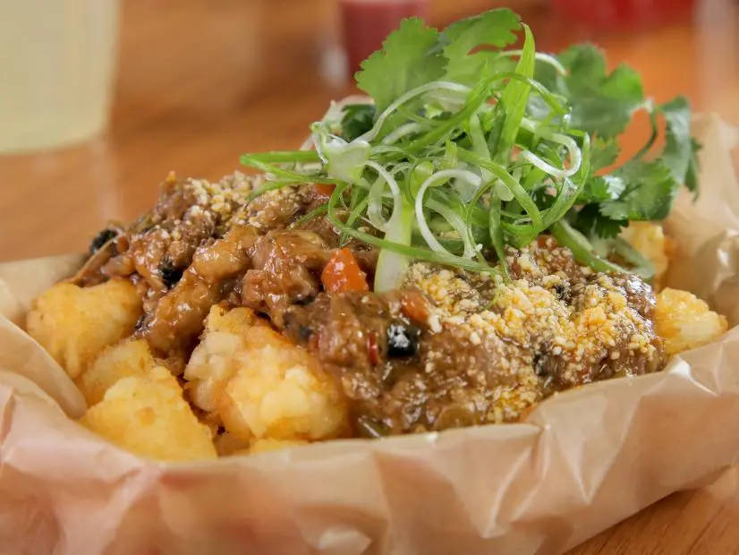 Oxtail chili tots as served at Belly & Snout in Los Angeles, CA as seen on Food Network's Diners, Drive-Ins and Dives episode 2502.