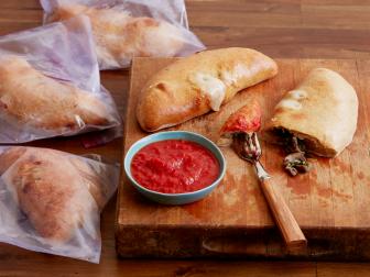 Food Network Kitchen’s Big Batch Healthy Beef, Mushroom and Spinach Calzones.