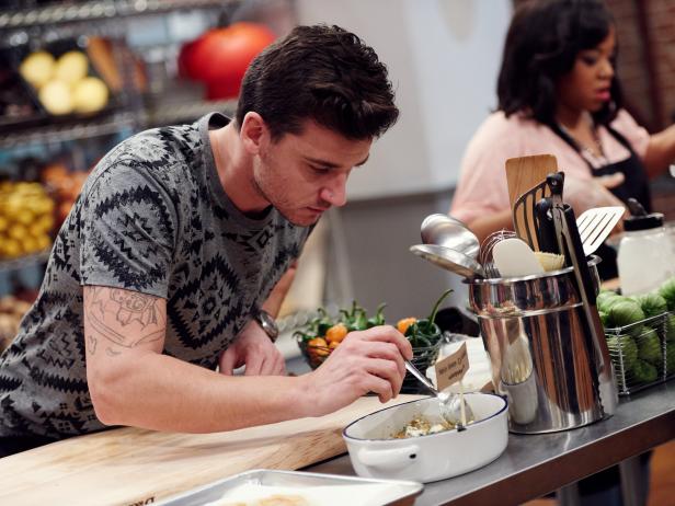 Finalist Damiano Carrara preparing his dish, Habanero Green Chile Enchilada, for the Mentor Challenge, Food Authority, as seen on Food Network Star, Season 12.