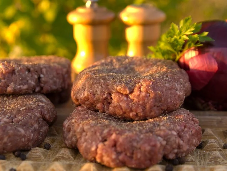 "Outdoor summer hamburger cooking; preparing cheddar cheese burgers for grilling on the barbeque. (SEE LIGHTBOXES BELOW for many more outdoor meals, picnic dining, and other food photos...)"