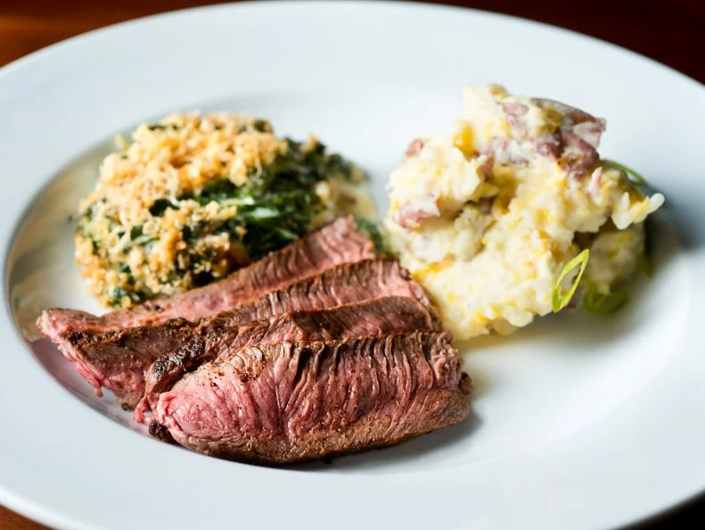 Sliced Flank Steak or Sirloin Steak with Mashed Potatoes and Casserole