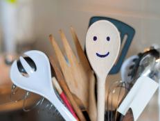 The wooden smiling spoon and kitchen accessories in the kitchen