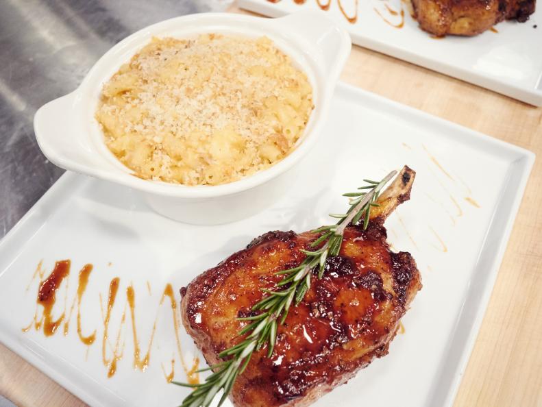 Finalist Jernard Wells' dish, Orange Maple Chipotle Pork Chop with Lobster Mac and Cheese, for the Mentor Challenge, Cook For Your Life, as seen on Food Network Star, Season 12.