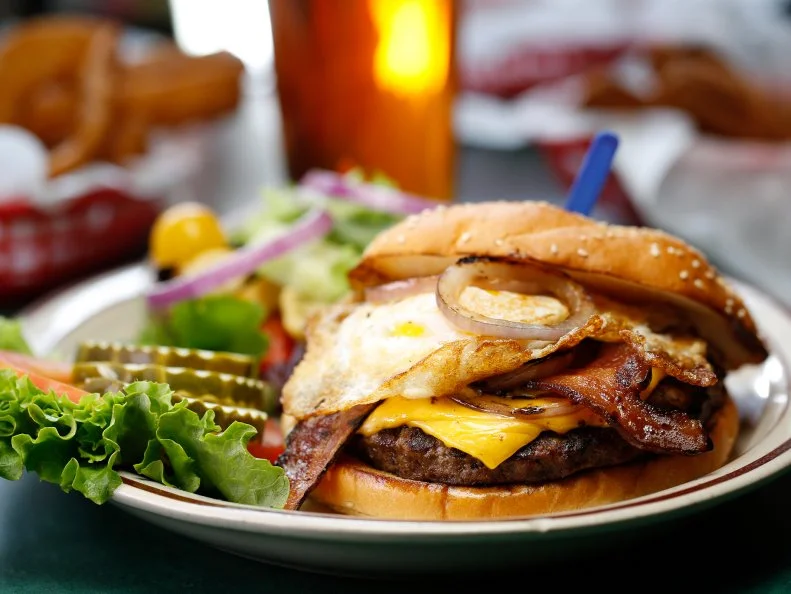 Adam Richman of Man v. Food once called the Cricket Burger the best he’s ever had. He’s not the only one to espouse the merits of this place. Cherry Cricket has been hailed by local and national publications on countless occasions. While much of the menu is a DIY hodgepodge of toppings, the namesake is the most popular. Fresh 80/20 Black Angus shoulder chuck patties are grilled over an open flame, creating a slight char and succulent interior. It’s finished with American cheese, sauteed onions, bacon and an over-easy egg.