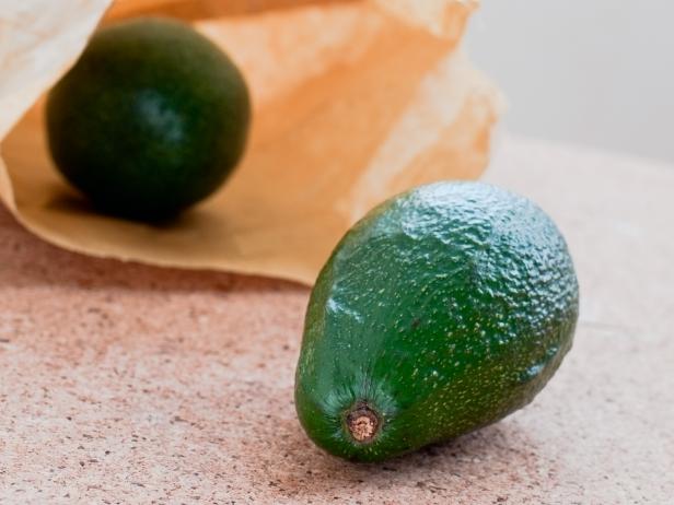 Stock photo of avocado out of paper bagSerie:
