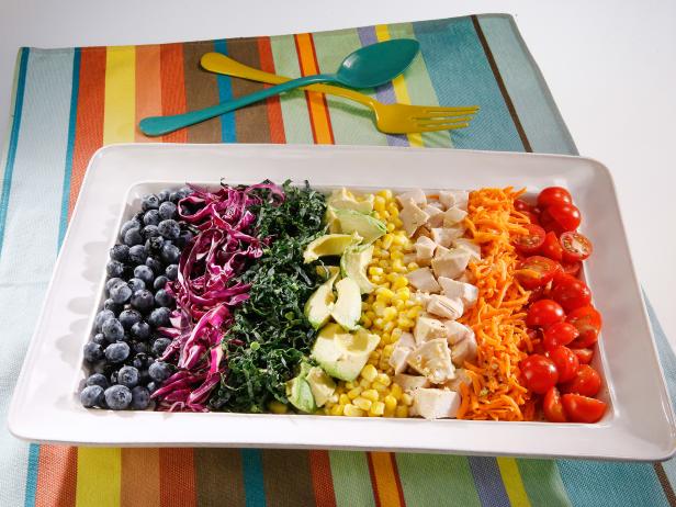 Rainbow salad is displayed during an episode about rainbow foods to brighten your day, as seen on Food Network's The Kitchen Sink, Season 1.
