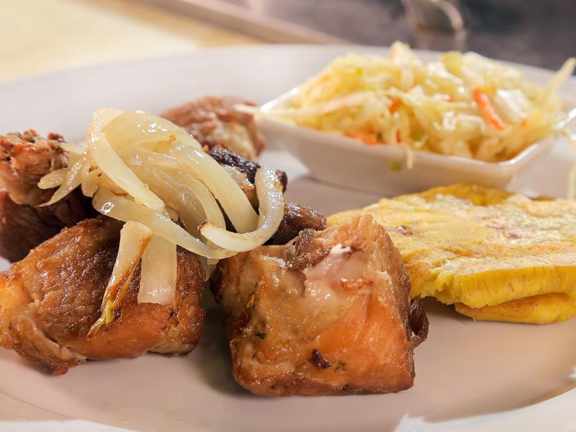 Griot with piklitz and plantains at Ivan's Cookhouse in Miami, FL as seen on Food Network's Diners, Drive-Ins and Dives episode 2506.