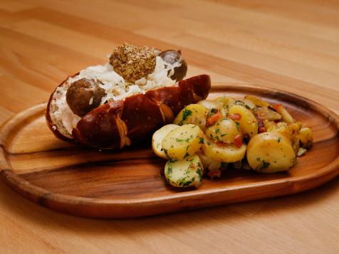 Pretzel Bun Reuben Sausage Sandwich with German-Style Potato Salad