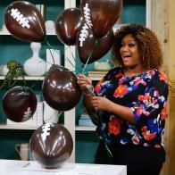 Host Sunny Anderson demonstrates Touchdown Touches, as seen on Food Network's The Kitchen, Season 12.