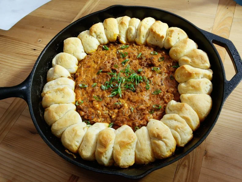 Chili Cheese Skillet Dip with Biscuit Dippers is displayed, as seen on Food Network's The Kitchen, Season 12.