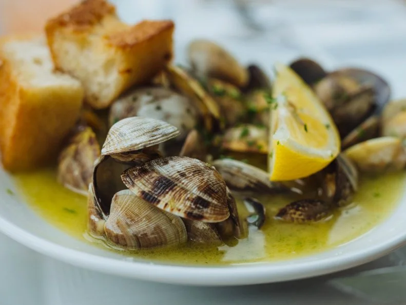 There are clams in nearly every estuary along the Oregon coast. At Local Ocean Seafoods, a bayfront seafood market and restaurant that gets most of its seafood from across the street, the bivalves are steamed with garlic, shallots, butter and white wine, dusted with chopped parsley and served with garlic bread. Sit downstairs at the Newport spot to watch the chefs in the open kitchen, or upstairs for views of the fishing boats in the harbor.