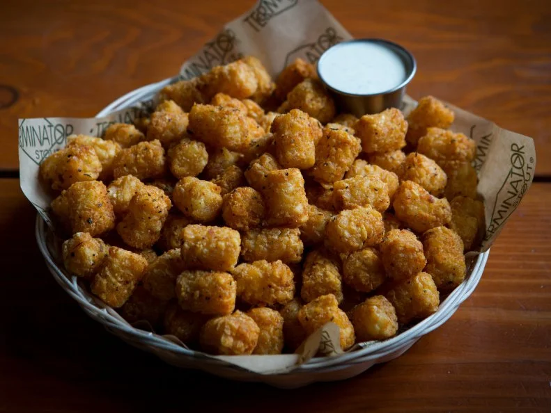 The “Ore” in “Ore-Ida,” which invented Tater Tots in the 1950s to use up potato slivers left over from making french fries, stands for “Oregon.” Tots are the most-popular menu item at brothers Mike and Brian McMenamin’s eponymous pubs, McMenamins, which buy more than 500,000 pounds of them each year. Get them tossed with Cajun spice mix and with housemade peppercorn ranch dressing on the side. 