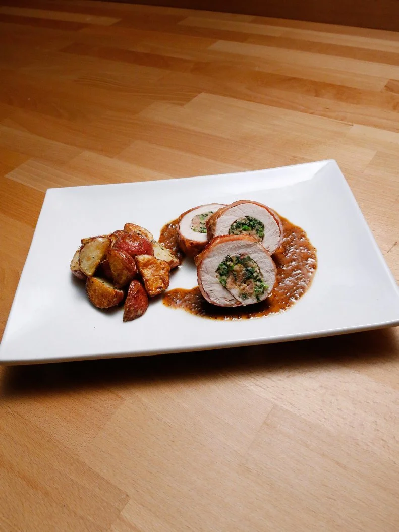 Mentor Anne Burrell's Pork Roulade with Roasted Red Potatoes dish is displayed, as seen on Food Network's Worst Cooks in America, Season 10.