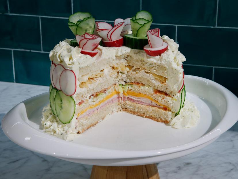 The Club Sandwich Cake is displayed, as seen on Food Network's The Kitchen Sink, Season 2.