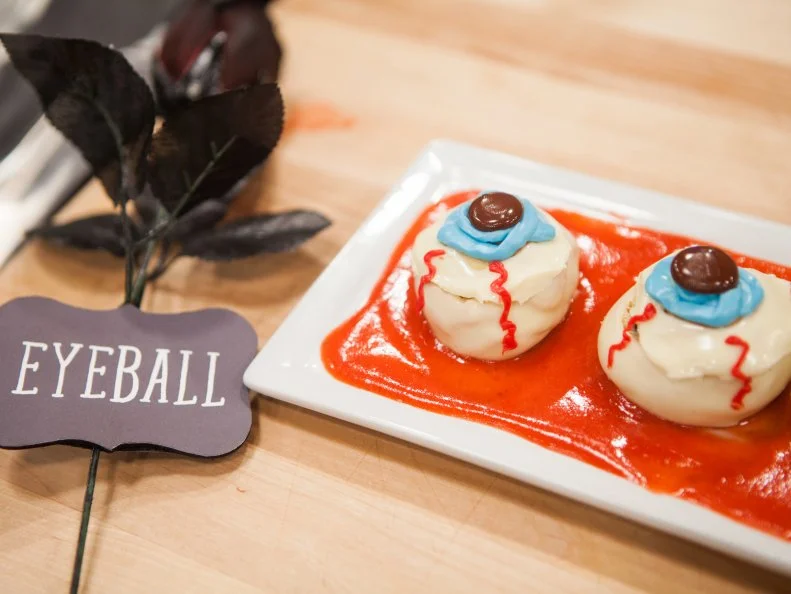 Jessica Scott's Eyeball themed SCREAM PUFF W/ MATCHA PASTRY CREAM, BLUEBERRY COMPOTE AND STRAWBERRY BLOOD COULIS, as seen on Halloween Baking Championship, Season 3.