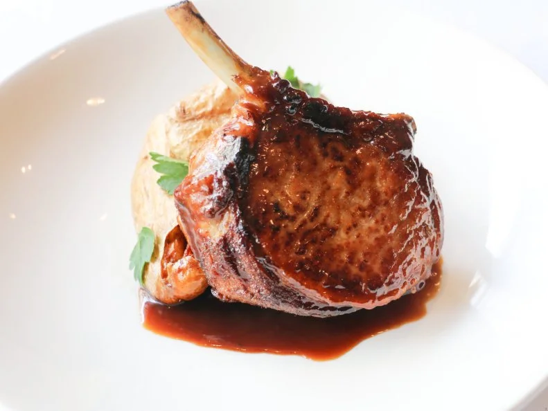 For more than 30 years, Grill 23 & Bar has set the bar for what a steakhouse should be, and while it has the requisite white tablecloths, enormous portions and servers clad in formal jackets, the beef is what really matters. The beef comes from a farm in California that raises vegetarian-fed, hormone- and antibiotic-free cows, which makes a difference in the taste of the beef. Seafood and produce, however, are sourced locally. A perfect meal here might  be a plate of raw oysters, the 14-ounce dry-aged prime New York strip, sides of broccoli rabe gratin and truffle oil tater tots, then the sublime coconut cake to finish.