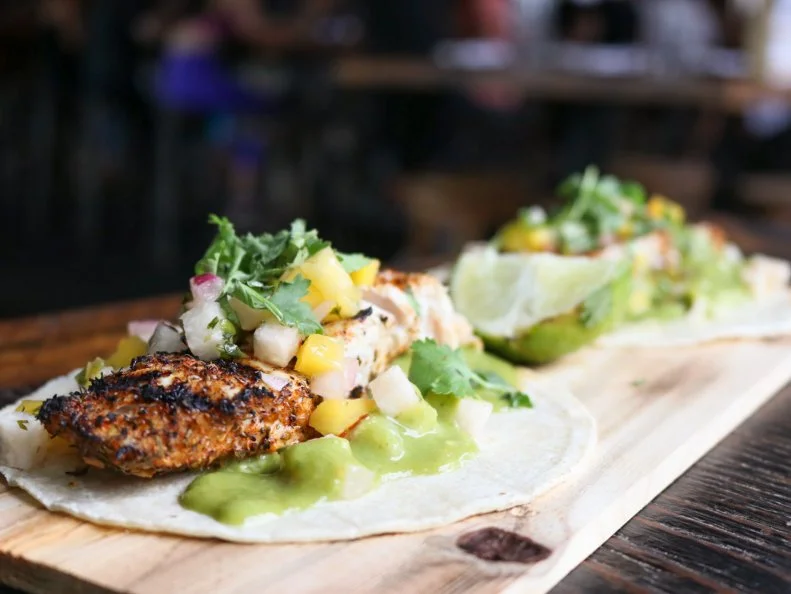 This lively South Boston restaurant always feels like a party, with a giant bar in the middle of its large room. The tequila and mezcal menus likely also have something to do with that. Those who can’t settle on one of the dozens and dozens of choices can go for one of the flights, such as the bartender’s favorites or the Tour de Mexico. Fun and inventive mixed drinks include the Rainbow Dragon, a Mai tai made with tequila. Tacos range from a somewhat traditional Baja-style fried fish, with charred jalapeno, pineapple aioli, pickled cabbage and avocado, to the fun General Tso’s Taco, with sweet and spicy glaze, pineapple rice, sesame and cilantro. The raw bar menu is outstanding, with gorgeous dishes like oyster ceviche topped with passionfruit, mango, pineapple, pomegranate, habanero and citrus.