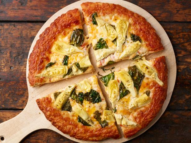 https://food.fnr.sndimg.com/content/dam/images/food/fullset/2017/10/4/0/FN_Frozen-Pizza-Spinach-and-Artichoke.jpg.rend.hgtvcom.616.462.suffix/1507129892855.jpeg