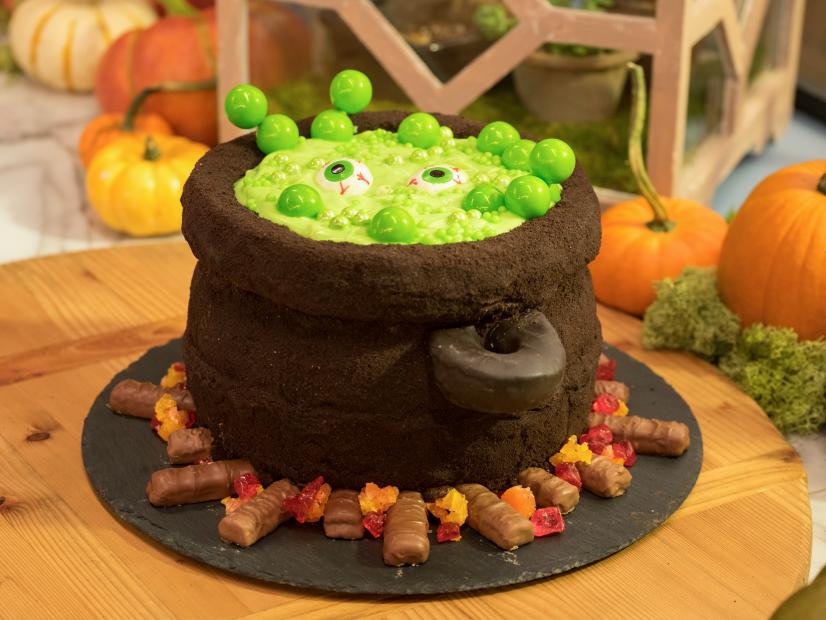 The hosts of the Kitchen Pass the Cauldron Cake, as seen on Food Network's The Kitchen