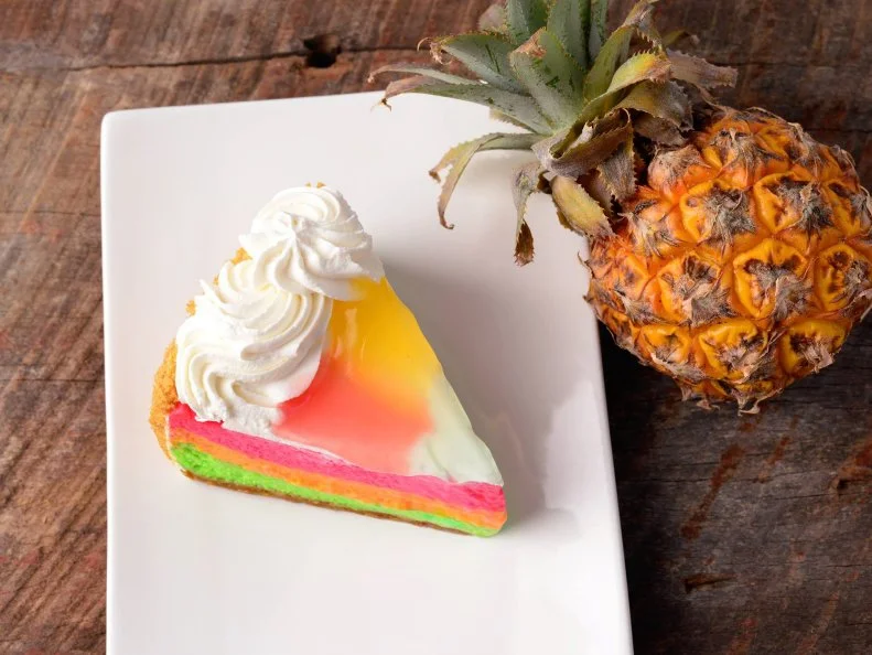 Before King’s Hawaiian became a supermarket staple, it was actually a bakery and restaurant in — you guessed it — Hawaii. After moving its roll-making operation to Southern California, the team re-established the storefront, where whole rounds and slices of its signature Paradise Cake fill the shelves. The tricolor chiffon was such a hit, a cheesecake version was later produced, with a creamy tartness that balances out the trio of tropical fruits (guava, passionfruit and lime). 