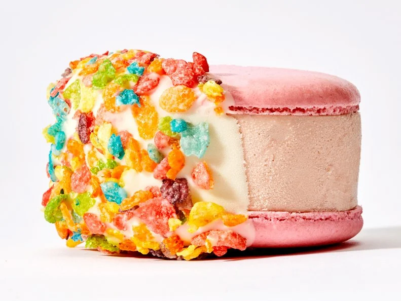 How do you take ice cream sandwiches to the next level? By swapping plain chocolate chip cookies with French macarons. Though theyâ  re available in a multitude of colors, the most eye-catching may be the Fruity Pebbles, a pink-on-pink confection partially dipped in white chocolate and the rainbow cereal.