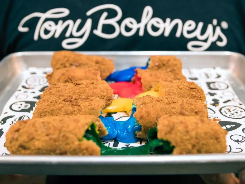 The mozzarella sticks at Tony Boloney’s are a labor of love. The New Jersey pizza joint makes everything from scratch, from the cheese to the bread to the natural food coloring. Chefs use beets, turmeric and other dehydrated fruits and seeds to stain the mozz, then roll each baton in a house blend of breadcrumbs, Pennsylvania Dutch pretzel bits and panko. They’re fried to a crisp golden-brown, then delivered to your table for the perfect cheese pull.