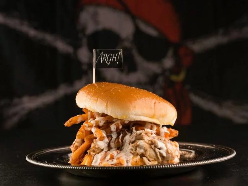 Adam Hoffman moved from California to Indiana to carve out a barbecue niche for himself when he opened his pirate-themed Big Hoffaâ  s. While the seafaring-outlaw motif may seem odd for a place serving American fare, for Hoffman itâ  s an ode to barbecueâ  s Caribbean origin. At his Westfield restaurant, pork and beef are slowly cooked for 25 to 30 hours in a large smoker outside that burns only firewood. The meat is wonderful on its own, but Hoffman integrates it into culturally influenced dishes based on his travels to more than 40 countries around the globe. One example is the Teriyaki Bowl: your choice of pulled pork, pulled chicken or brisket, layered over jasmine rice and drizzled with teriyaki sauce. Try the Buccaneer, pulled pork topped with coleslaw, fries and ranch dressing on a bun slathered with garlic butter.
