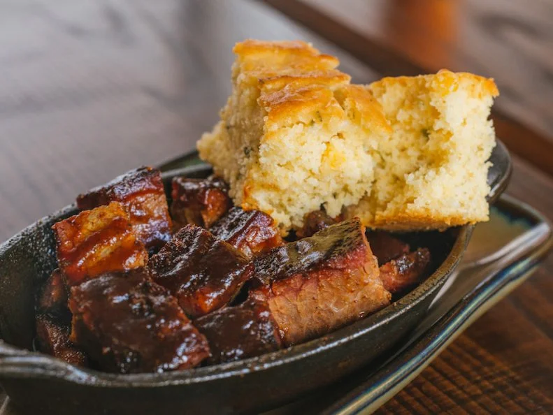Kansas City has so many great barbecue spots that narrowing down the list of places to visit is like herding cats. So what sets this place apart? Chef and pitmaster Rob Magee graduated from the prestigious Culinary Institute of America before starting a three-decade career in high-end dining. While working as an executive chef for Hilton, Magee got into competitive barbecue. He and his team, Munchin Hogs, began accruing trophies for dishes like apple-brined pulled pork, brisket, smoked chicken and that Kansas City standby, burnt ends, all of which are now available in various forms at Q39. The entire menu is made from scratch in the open kitchen. For that, it draws some serious crowds. Arrive early and expect to wait — it’ll be worth it.