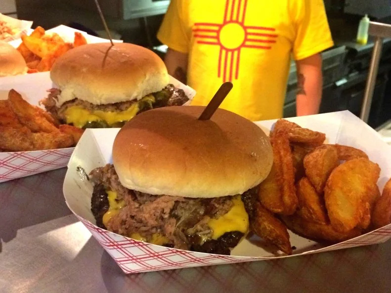 Find great smoked meat at this kitschy burger joint filled to the brim with vintage memorabilia and knickknacks — including an awesome moose head capped with a hat fit for a park ranger. The place is best known for its excellent chile cheeseburger, but it also offers a unique, New Mexican take on smoked meat. The best way to sample the goods is with the Oinker, the infamous Hatch green chile cheeseburger topped with a healthy serving of smoked pulled pork. Purists may prefer to stick with simpler barbecue plates featuring slow-cooked meats like sliced brisket, sausage and spare ribs.