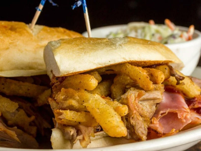 The smell of smoke from this bar and grill carries through the West Fargo air. The concept focuses on three things: wood fire, smoke and fresh ingredients. Here, steaks, burgers and even fish are cooked right on a special grill that hangs over roaring oak flames. When they say their barbecue is award-winning, they mean it. The crew regularly participates in Kansas City BBQ Society-sanctioned competitions, earning recognition for their 12-hour brisket, pork shoulder, slow-smoked ribs and moist spit-fire chicken. Try all of the above in the cozy brick-covered dining room or at the convivial bar.