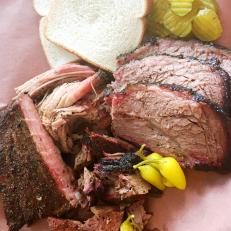Texas barbecue spread north to South Dakota when Big Rig BBQ opened on Memorial Day weekend in 2015. Brisket, pork ribs, pulled pork and chicken are sold by the half-pound or in sandwiches. Friday and Saturday nights, prime rib is slow-smoked like the ’cue with real oak wood, also served in half-pound portions. Just like they do in Texas, owner Bob Brenner takes his meat seriously, adding extra wood every 30 to 45 minutes through the long, drawn-out cooking process. Although he makes his own sauce from scratch, Brenner adheres to a “sauce optional” philosophy. He wants guests to take a bite to sample the natural flavors of the meat before adding accoutrements to their meal.