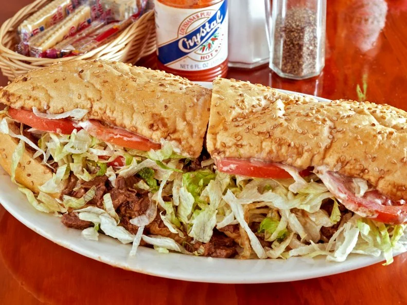 There are po’ boys nearly everywhere in New Orleans. For good reason: They’re reasonably priced, filling and about as egalitarian as a local food can be. Fried seafood po’ boys get much of the love, but consider the unsung hero of po’ boy land: the roast beef po’ boy. Here in the first suburb west of New Orleans proper is R&Os, home of the finest roast beef po’ boy with gravy that can be. You’ll want yours “dressed,” which means finished with tomato, shredded lettuce and mayo. It’ll be a messy eating experience. Worth every dribbly elbow.