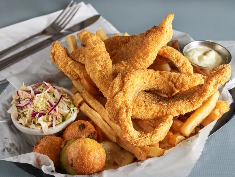 High Hat bills itself as a restaurant inspired by the Mississippi Delta. That would be a reference to the area in the northwest of the state of Mississippi where the blues were born. Hot tamales are a fixture in the region, and they’re on the menu at High Hat, pliant and porky and served with a side of drippings. The fried catfish is probably the finest in New Orleans city limits, and if you’ve been partying your way through the City That Care Forgot, get yourself a pimento cheese burger and a side of braised greens to steady yourself until your next adult beverage.