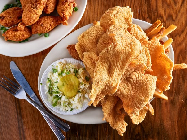 You could order regular fried catfish at this destination-worthy, oversized restaurant on a patch of land between Lake Maurepas and Lake Pontchartrain. That would be a mistake, though. It’s not because the well-seasoned crust and flaky fish is bad. Far from it: It’s near perfection. The reason is that Middendorf’s is the home of the magical alchemy that birthed thin-fried catfish, the institution’s signature preparation. Impossibly slight planks of catfish are battered and fried. It’s like eating catfsh air. If that air were perfectly seasoned, fried impeccably and worth driving for. 