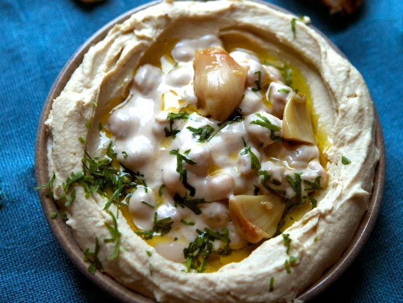 This is what happens when a chef adept with pizza dough and wood-burning ovens turns his attention to the food of his lineage, Israrel. The pita is revelatory: Charred, light and buoyant. Itâ  s an optimal messenger for the silky hummus and any of the small dishes, like red-pepper puree, thick yogurt of wood-roasted okra.