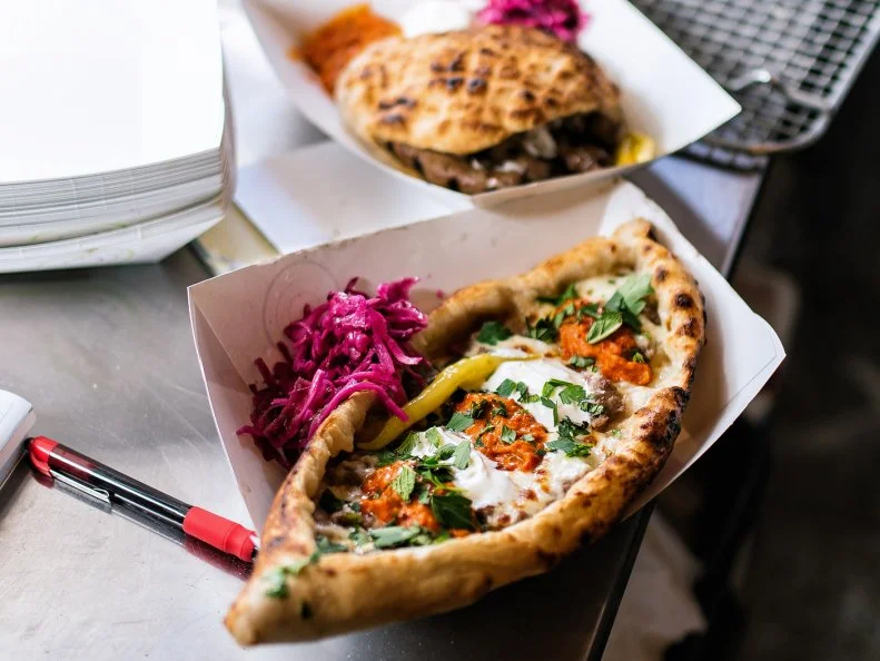 Did you know the largest Bosnian population outside of Europe is in St. Louis? Surprise! You could head to â  Little Bosnia,â   better known as Bevo Mill, or you could track down the Balkan Treat Box food truck. Owners Loryn and Edo Nalic combine their Balkan background with their experience working at some of St. Louisâ   best restaurants to create unforgettable dishes. The flavor is unrealâ  almost all the dishes are cooked using the truckâ  s built-in wood-fired grill and oven. Pillowy somun bread is baked fresh; minced beef sausages called cevapi are grilled to order and served with a spicy red pepper relish. The real star, though, is the Turkish-inspired pide, a grilled flatbread stuffed with meat or cheese; itâ  s like the missing link between a pizza and a calzone.
