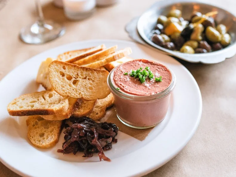 French fare has the reputation for being stuffy and heavy, but that’s not the case at Brasserie. The food pays homage to, well, the French brasserie — a relaxed neighborhood restaurant where one can have a simple meal with friends and family. Whether you decide to take a seat at the bar and enjoy a cocktail with some gougeres and a Brasserie Burger or head into the main dining room for a romantic dinner, you’ll feel right at home. Larger plates include French classics like coq au vin, steak frites and possibly the best roasted chicken you’ll ever have, served over bread and mushrooms, which are perfect for soaking up the buttery jus. Make sure to save room for the decadent desserts, like the profiteroles du jour or the classic floating island.