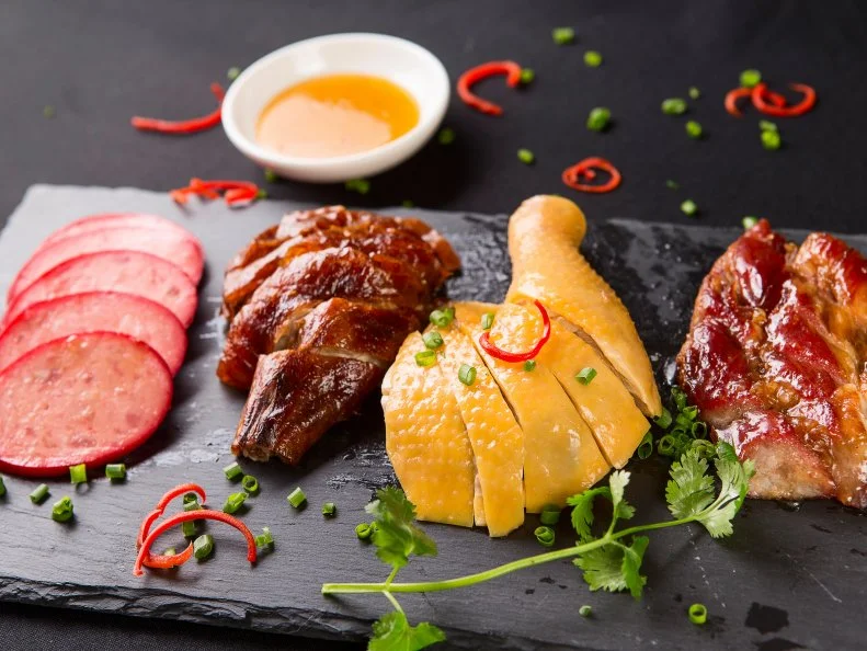 Bang bang, you’re not dead; you’re at London’s new mega Asian food hall, a cavernous kingdom in Colindale — go any farther north and you’ll fall off the face of the earth — that takes inspiration from Asian street-food markets. There’s a dizzying array of bites and chomps to choose from — 33 kiosks in total — and space for up to 450 bottoms. China takes center stage, but Korea, Japan, India, Vietnam, Malaysia, Singapore and Taiwan are all repped pretty strongly too. Try toothsome roast duck in a seductively soy-y, lick-yer-lips sticky glaze from Four Seasons, pandan custard tarts from Wonder Bake, pan-fried Chinese dumplings (and congee porridge, perhaps?) from Xi Home and sushi from Umi (not necessarily in that order). Post-feast, get your nails done at one of the little beauty parlors on the mezzanine or realign your qi with a trip to the herbal medicine store. Dining out is an arduous task; unwind with a post-noodle massage.


Also try: Black Axe Mangal, Canonbury; Franks Canteen, Highbury
