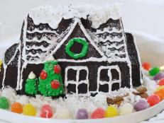A gingerbread house cake mold lets you skip the hassle of assembling fragile cookie panels and gets you straight to the fun part: putting on the candy decorations. Gather some colorful options-- think gumdrops, candy canes, sprinkles-- and go to town.