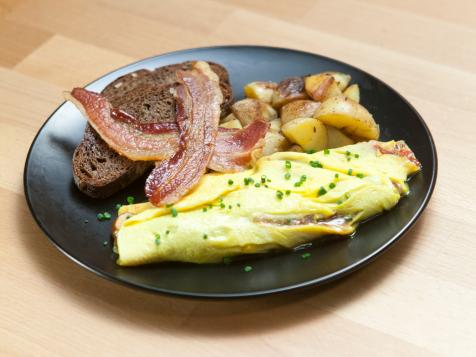 Mushroom, Tomato and Onion Omelet with Home Fries and Bacon