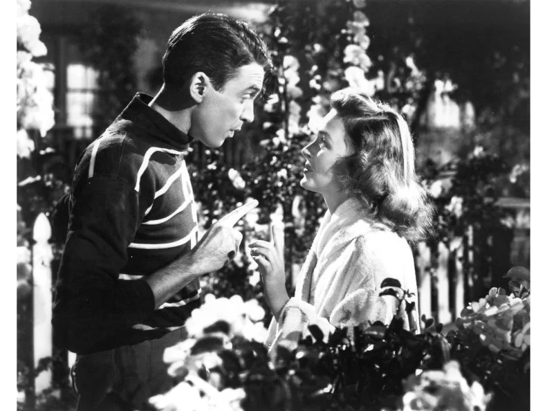 American actors James Stewart (1908 - 1997) as George Bailey, and Donna Reed (1921 - 1986) as Mary Hatch Bailey in a promotional still from 'It's A Wonderful Life', directed by Frank Capra, 1946.