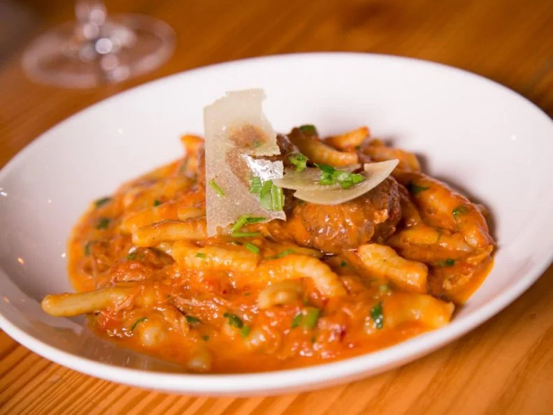 Pasta whiz Michael Pirolo, chef-owner of this Miami Beach trattoria, spent years traveling around Italy, spending time in Michelin-starred kitchens throughout the boot before going on to work with Scott Conant at Scarpetta. Thatâ  s why his food is so superlative, including strands of spaghetti in cacio e pepe and hollow cavatelli in the restaurant's namesake dish. However, Piroloâ  s skilled hands create magic beyond pasta: The menu provides an excellent compilation of old-country specialties, like housemade porchetta, veal and pork meatballs and locally caught seafood.(Listing: http://www.foodnetwork.com/restaurants/fl/miami-beach/macchialina-restaurant)